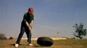 Nick practises his swing power against a tyre