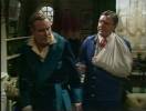 The injured Bunter (Glyn Houston) comes to Wimsey in a flashback
