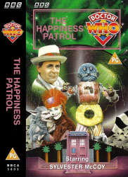Michael's audio cassette cover for The Happiness Patrol, art by Colin Howard